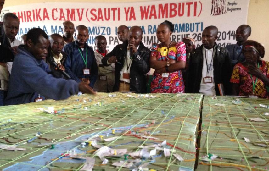 Batwa (also known as Bambuti or Wambuti) at the 2014 Whakatane Dialogue showing PNKB staff Batwa ancestral lands at PNKB, through using a 3D map created with CAMV and FPP