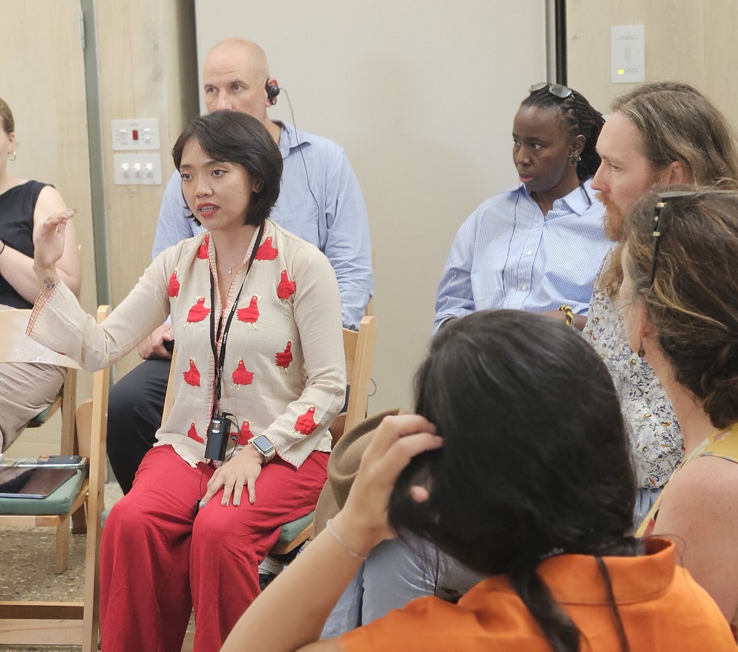 A women speaking waving her hands