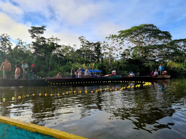 Men in boats on a river