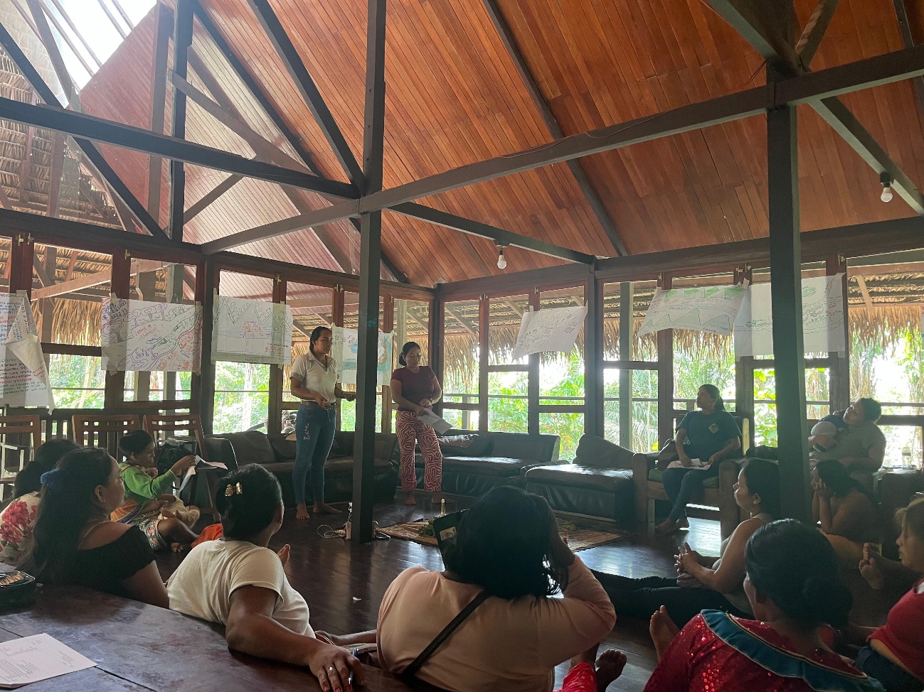 Women speaking infront of a crowd