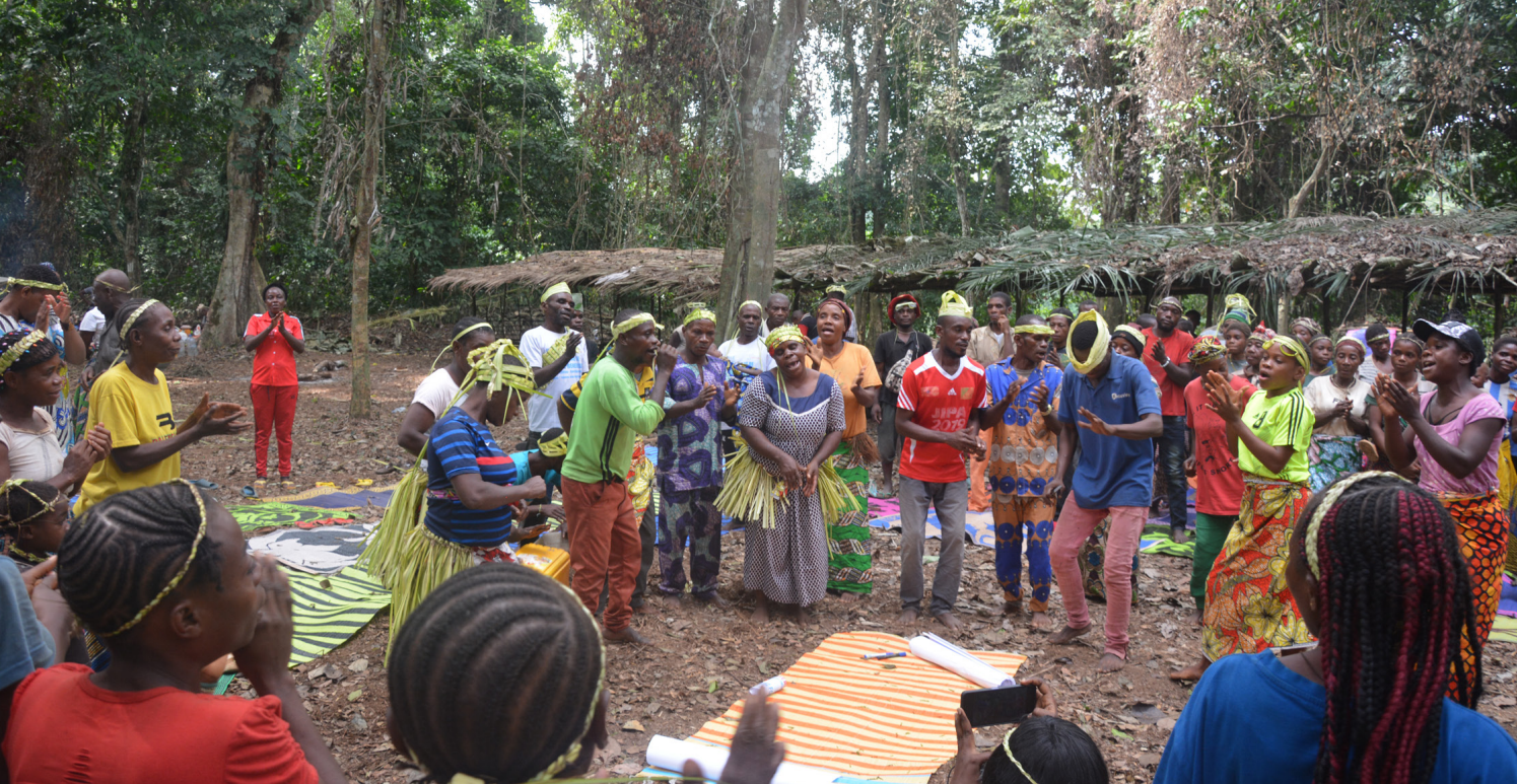 A group of people stood in a forest