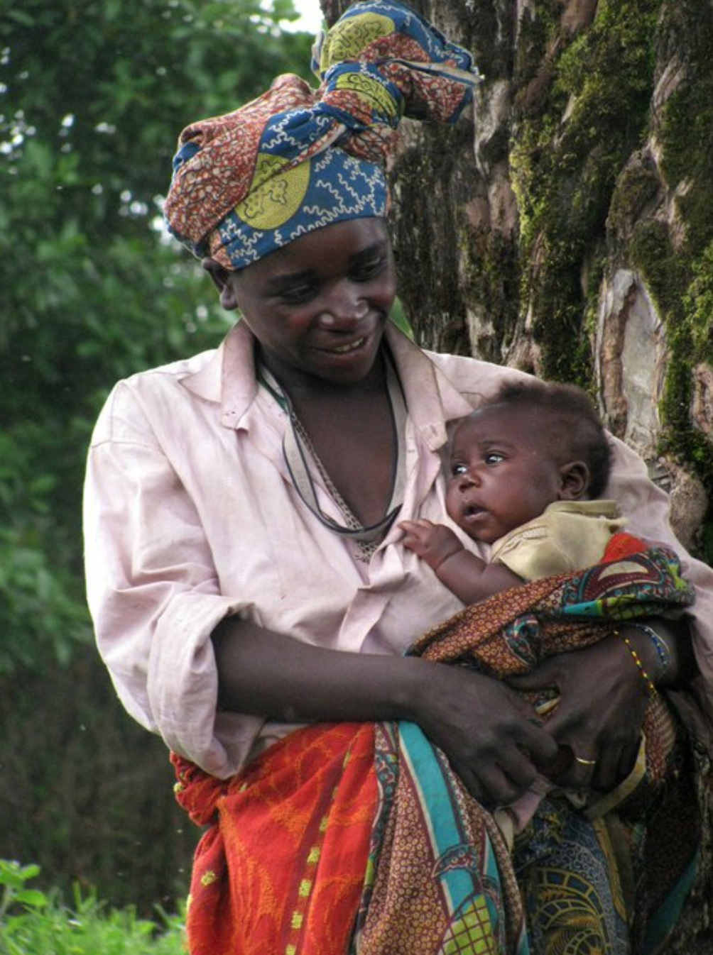 Batwa woman with her baby in Uganda